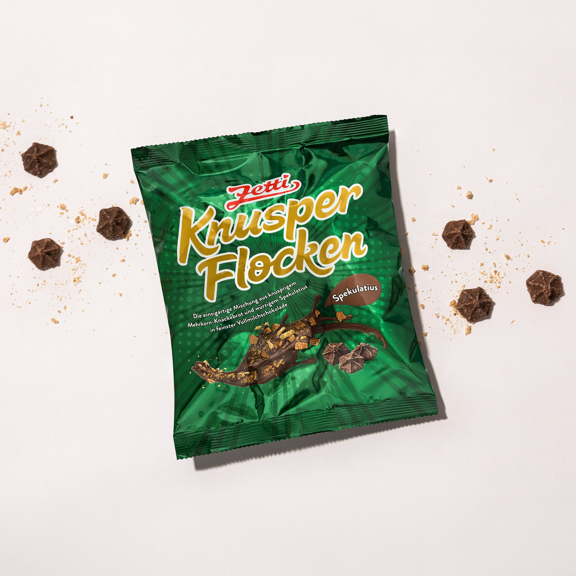 Zetti Knusperflocken Spekulatius (5 Stück)  Eine Packung Zetti Knusperflocken Spekulatius eingebettet in Knusperflocken und Knäckebrot