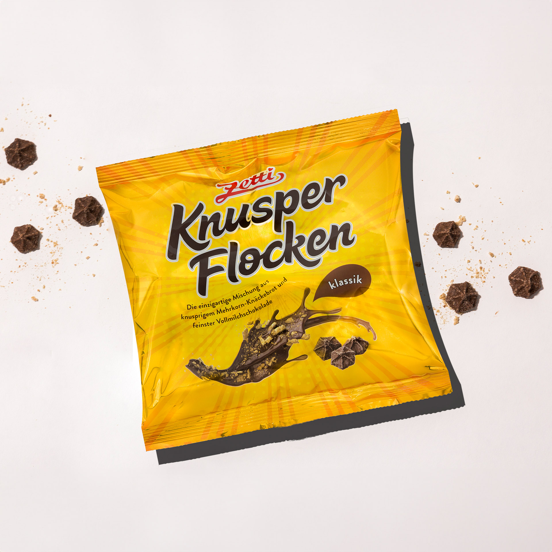 Zetti Knusperflocken Klassik 270g Eine Packung Zetti Knusperflocken Klassik eingebettet in Knusperflocken und Knäckebrot